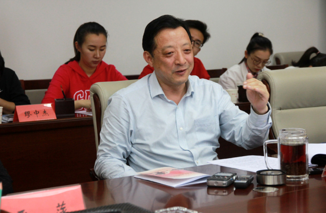 Dong Yifeng, Secretary of the party committee of the 8th division of Xinjiang production and construction corps, during an interview in Shihezi Party and government service center, Shihezi, Xinjiang, April 4, 2019. [Photo: Shihezi Daily/ Xu Rongfang]