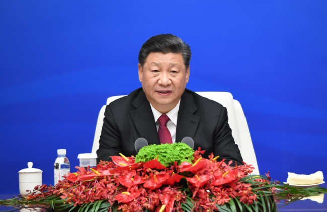 Chinese President and Central Military Commission Chairman Xi Jinping addresses heads of foreign delegations invited to events marking the 70th founding anniversary of the Chinese People's Liberation Army Navy in Qingdao, Shandong Province on Tuesday, April 23, 2019. [Photo: Xinhua]