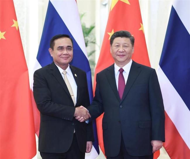 Chinese President Xi Jinping (R) meets with Thai Prime Minister Prayut Chan-o-cha, who is attending the Second Belt and Road Forum for International Cooperation, in Beijing, capital of China, April 26, 2019. [Photo: Xinhua]