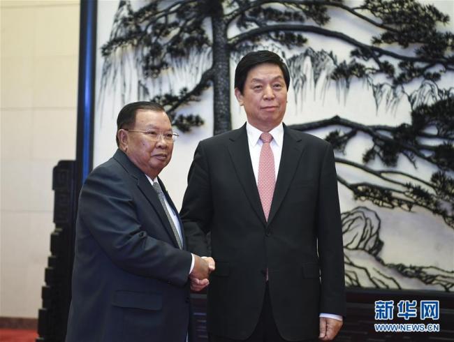 Chinese top legislator Li Zhanshu meets with Lao President Bounnhang Vorachit, who is attending the Second Belt and Road Forum for International Cooperation in Beijing, April 26, 2019. [Photo: Xinhua]