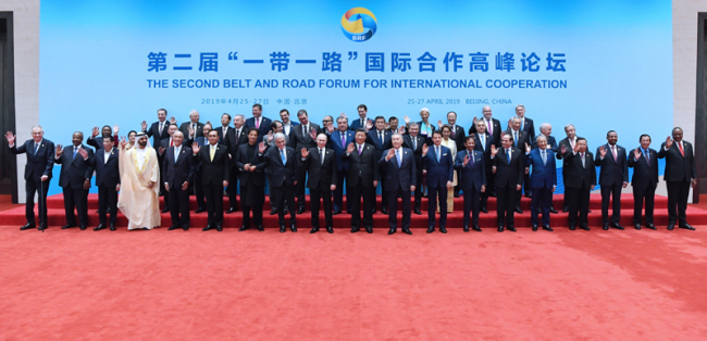 President Xi Jinping takes a group photo with foreign leaders and heads of international organizations during the leaders' roundtable meeting of the Second Belt and Road Forum for International Cooperation at the Yanqi Lake International Convention Center in Beijing, April 27, 2019. [Photo: Xinhua]