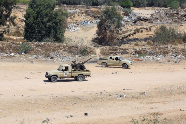 Libyan security forces patrol an area on August 23, 2018 near the site of an attack on a checkpoint in the city of Zliten, 170 km east of the capital Tripoli. An attack on a checkpoint between the Libyan capital and the town of Zliten killed six soldiers of the UN-backed unity government, an interior ministry source said. [File Photo: AFP]