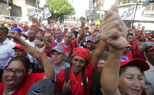 Supporters of Venezuela's President Nicolas Maduro rally in his support outside Miraflores presidential palace, during an attempted military uprising in Caracas, Venezuela, Tuesday, April 30, 2019. [Photo: AP]