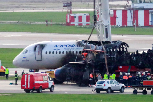 Emergency workers at the site of a crash of a Russian-made Superjet-100 at Sheremetyevo airport outside Moscow, May 6, 2019. [Photo: IC]