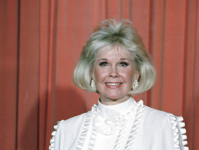 Actress and animal rights activist Doris Day poses for photos after receiving the Cecil B. DeMille Award she was presented with at the annual Golden Globe Awards ceremony in Los Angeles, Jan. 28, 1989. [File photo: AP]