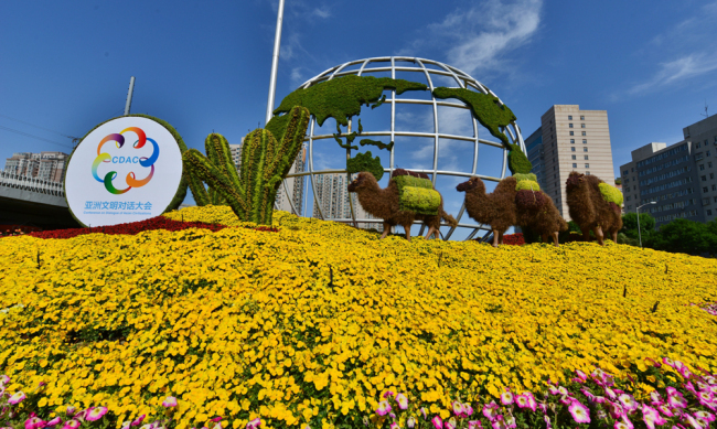 A view of the Conference on Dialogue of Asian Civilizations themed flower garden is showed in downtown Beijing on May 3, 2019. [File Photo: IC]