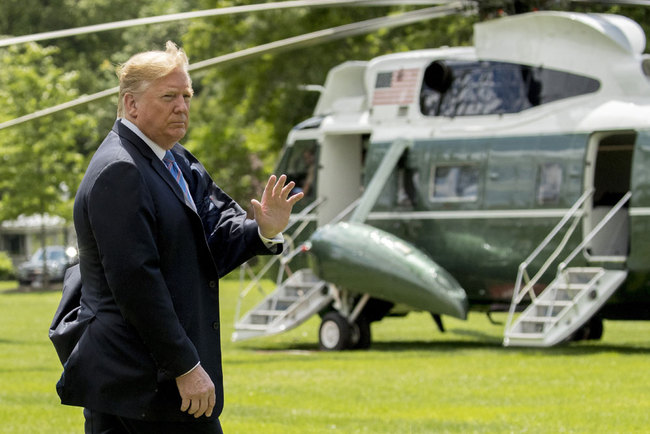 President Donald Trump waves to members of the media on the South Lawn of the White House in Washington, Tuesday, May 14, 2019, before boarding Marine One for a short trip to Andrews Air Force Base, Md., to travel to Louisiana. [Photo: AP/Andrew Harnik]