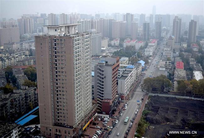 Photo taken on Nov. 18, 2015 shows residential buildings in Zhengzhou, capital of central China's Henan Province. [File Photo: Xinhua]