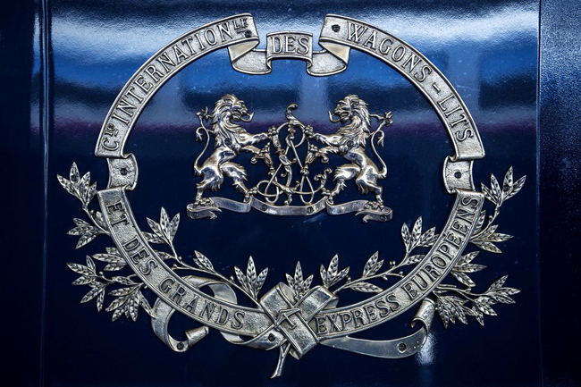 The picture taken on May 13, 2019 shows a blazon on a carriage of a restored Orient Express train displayed at the Gare de l'Est train station in Paris. [Photo: AFP/Christophe Archambault]