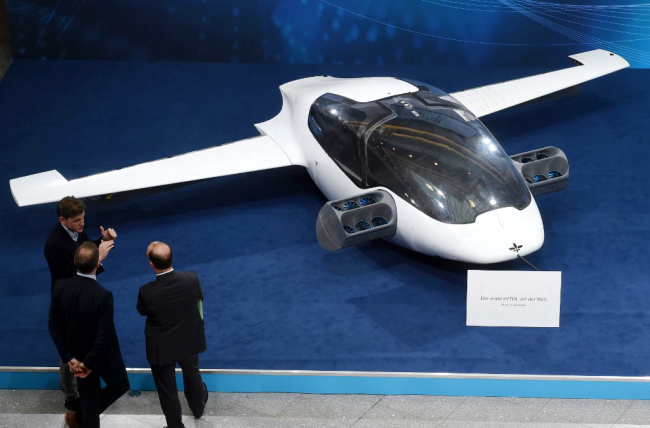 Visitors watch a prototype of the first air taxi, the eVTOL - electric vertical take-off and landing Jet - of the company Lilium during the trade fair Digital Summit in Nuremberg, southern Germany on December 4, 2018. [File photo: AFP]