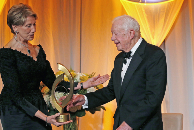 In this Jan. 27, 2017, file photo, former President Jimmy Carter, right, accepts the O'Connor Justice Prize from former U.S. Ambassador to Finland Barbara Barrett, left, at The Sandra Day O'Connor College of Law at Arizona State University Justice Prize Dinner in Phoenix. President Donald Trump has nominated Barrett to be the next secretary of the Air Force. [File photo: AP/Ross D. Franklin]