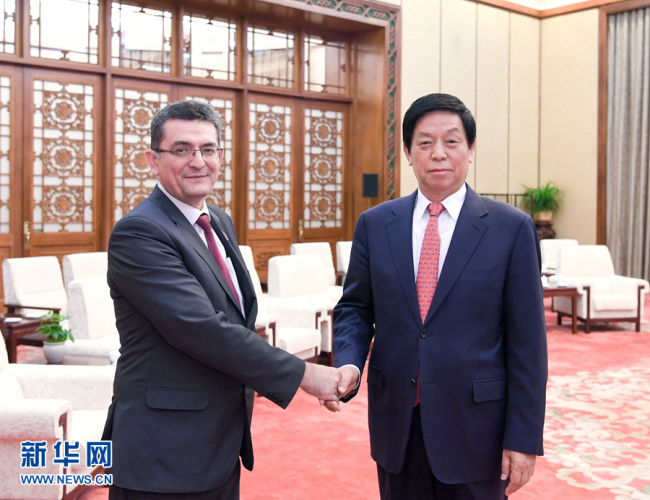 China's top legislator Li Zhanshu meets with Veroljub Arsic, deputy speaker of the National Assembly of Serbia, in Beijing on May 27, 2019. [Photo: Xinhua]