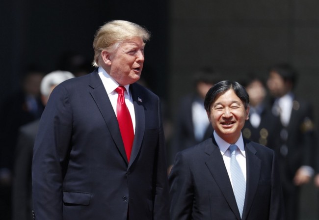 US President Donald Trump is escorted by Japan's Emperor Naruhito during a welcome ceremony at the Imperial Palace in Tokyo on May 27, 2019. [Photo: AFP]