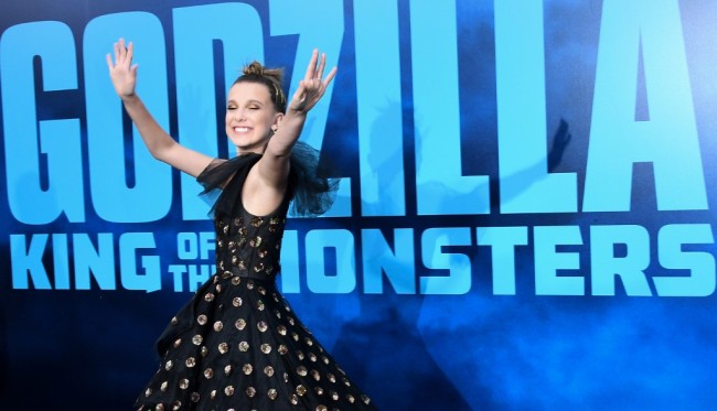 In this file photo taken on May 18, 2019 English actress Millie Bobby Brown arrives to attend the world premiere of "Godzilla: King of the Monsters" at TCL Chinese Theatre in Hollywood. Warner Bros.' "Godzilla: King of the Monsters" stomped to the top of the box-office in its opening weekend in North American theaters, taking in an estimated $49 million, industry watcher Exhibitor Relations reported. But analysts called the creature feature's debut disappointing. Its total for the three-day weekend came in far behind the studio's previous "Godzilla" installment (which opened in 2014 with $93 million), and the new film cost $200 million to make. [File photo: AFP]