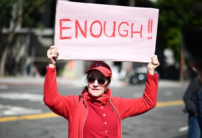 People protest against U.S. President Donald Trump's declaration of a National Emergency in order to receive funding to build his proposed border wall, February 18, 2019, outside City Hall in Los Angeles, California. The event is part of a nationwide mobilization in response to Trumps's invoking of a national emergency to receive more funding for a border wall along the U.S.-Mexico border. [Photo: AFP]