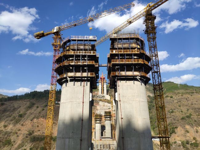Wang Chuanlin says Chinese engineers and workers are building the world’s highest piles, standing 154 meters high, for any steel composite beam bridge for the Yuxi-Mohan railway in Yunnan Province. [Photo: courtesy of China Tiesiju Civil Engineering Group]