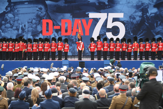 Guardsmen parade on stage during an event to commemorate the 75th anniversary of the D-Day landings, in Portsmouth, southern England, on June 5, 2019. [Photo: AFP/Daniel Leal-Olivas]