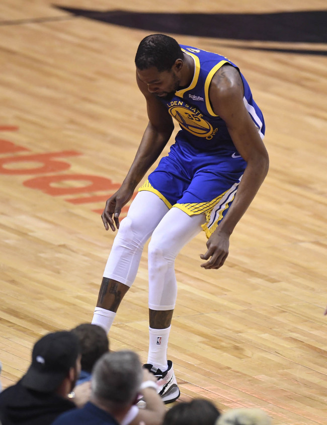 Golden State Warriors forward Kevin Durant (35) hobbles after injuring his right leg during first-half basketball action in Game 5 of the NBA Finals against the Toronto Raptors in Toronto, Monday, June 10, 2019. [Photo: Frank Gunn/The Canadian Press via IC]