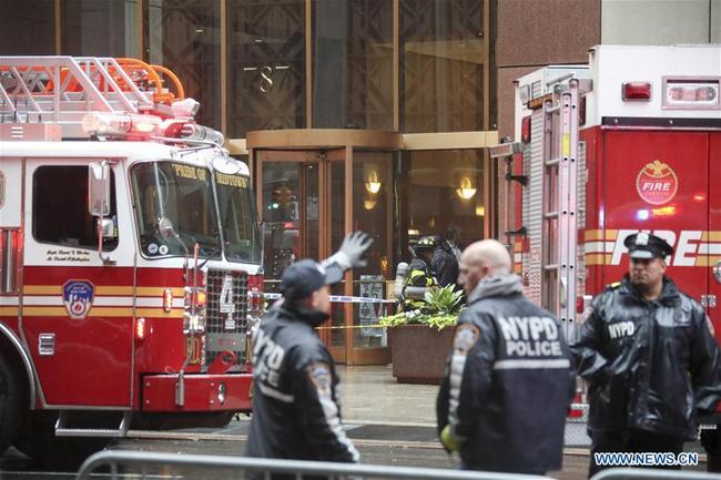 Rescuers and police officers work near the building where a helicopter crashed in Manhattan, New York, the United States, June 10, 2019. [Photo: Xinhua]