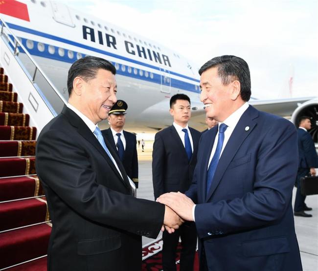 Chinese President Xi Jinping is received by his Kyrgyz counterpart Sooronbay Jeenbekov upon his arrival in Bishkek, Kyrgyzstan, June 12, 2019. Xi arrived here Wednesday for a state visit to Kyrgyzstan and the 19th Shanghai Cooperation Organization (SCO) summit. [Photo: Xinhua/Xie Huanchi]