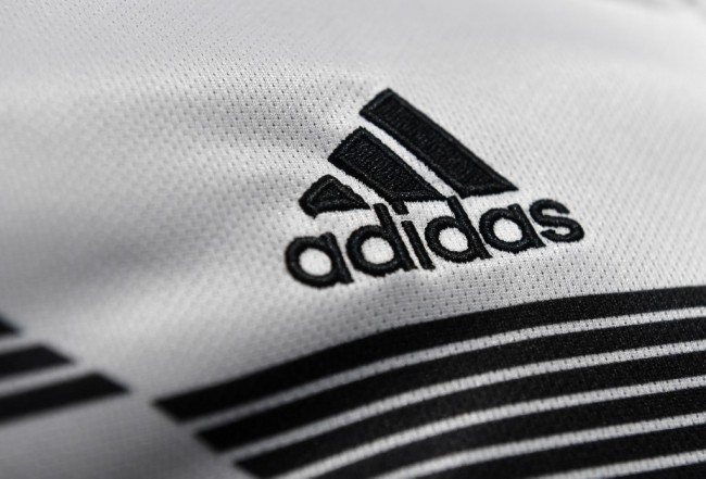 The Adidas company logo is on display during the company's annual press conference of Germany's sportgoods company Adidas in Herzogenaurach, southern Germany, on March 14, 2018. [Photo: AFP]