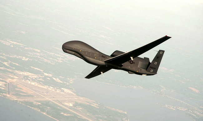 A handout photo made available by the US Navy provided by Northrop Grumman, a RQ-4 Global Hawk unmanned aerial vehicle conducts tests over Naval Air Station Patuxent River, Maryland on June 25, 2010. [Photo: IC]