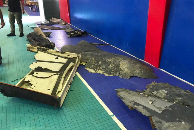 A handout picture obtained by AFP from Iranian State TV IRIB on June 21, 2019 shows what Iran says are debris from a downed US drone recovered inside its territorial waters, displayed by the Revolutionary Guard in Tehran. [Photo: IRAN STATE TV IRIB / AFP]