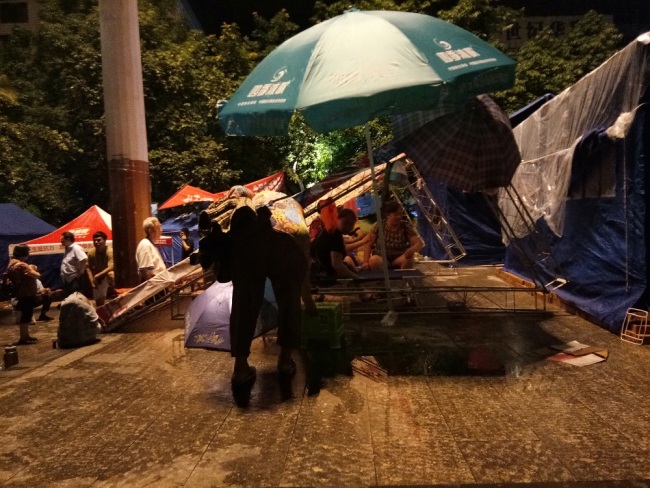 People gathering at a temporary shelter after a 5.4-magnitude earthquake rattled Gongxian County of Yibin City in southwest China's Sichuan Province, June 22, 2019. [Photo: IC]