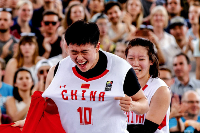 China's Zhiting Zhang celebrates as her team wins the final against Hungary in the FIBA 3x3 World Cup basketball at the Museumplein in Amsterdam on June 23 2019. [Photo: VCG]