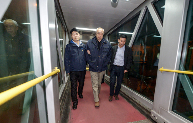 Jiang Wei, former top-ranking official at the China Association of Automobile Manufacturers, who was on the run in New Zealand for corruption, arrives as he is repatriated in Beijing on December 14, 2018. [Photo: IC]