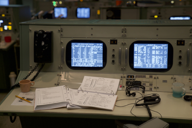 Original flight control consoles and binders are shown at the newly restored Apollo Mission Control Room at NASA's Johnson Space Center in Houston on June 28, 2019. [Photo: AFP/Kacey Cherry]