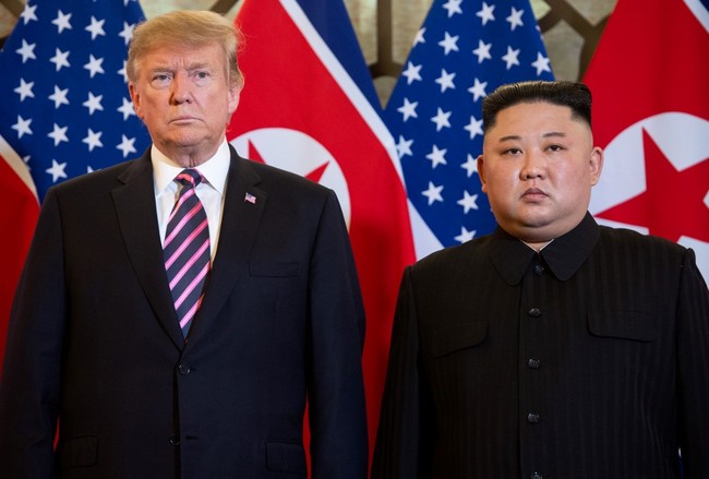 In this file photo taken on February 27, 2019 US President Donald Trump (L) and DPRK leader Kim Jong Un pose before a meeting at the Sofitel Legend Metropole hotel in Hanoi. [Photo: AFP]