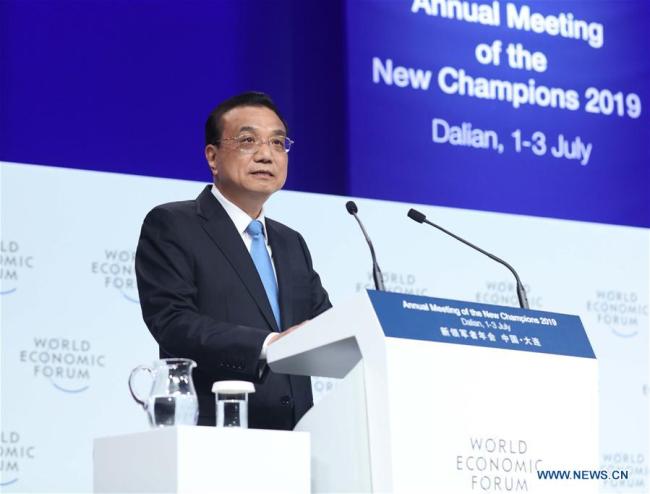 Chinese Premier Li Keqiang addresses the opening ceremony of the Annual Meeting of the New Champions 2019, also known as the Summer Davos Forum, in the city of Dalian, northeast China's Liaoning Province, July 2, 2019. [Photo: Xinhua/Liu Weibing]