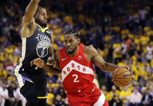 In this June 13, 2019, file photo, Toronto Raptors forward Kawhi Leonard (2) drives against Golden State Warriors forward Andre Iguodala (9) during the first half of Game 6 of basketball's NBA Finals in Oakland, California, U.S. [Photo: IC]