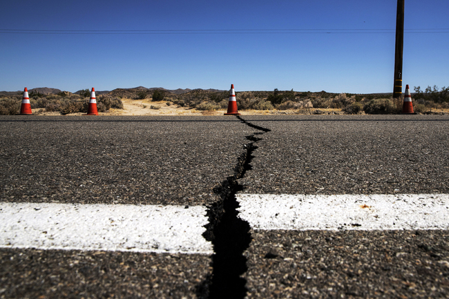 A crack crosses the road of Hwy 178 east of Ridgecrest after a magnitude 6.4 earthquake struck Thursday morning in the Mojave Desert's Seamless Valley on July 4, 2019. [Photo: IC]