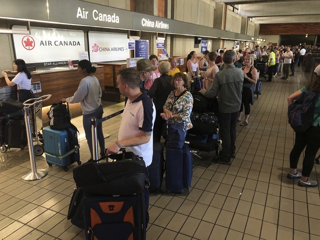 Passengers from an Australia-bound Air Canada flight diverted to Honolulu Thursday, July 11, 2019. [Photo: AP]