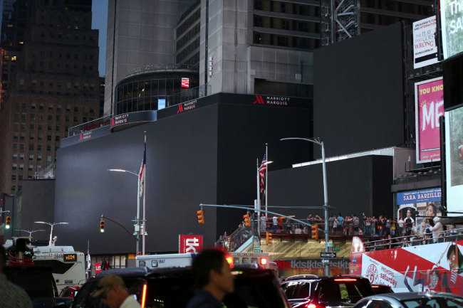 Screens in Times Square are black during a widespread power outage, Saturday, July 13, 2019, in New York. [Photo: IC]