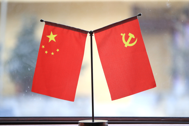 The national flag of China and the Party flag of CPC. [Photo: IC]