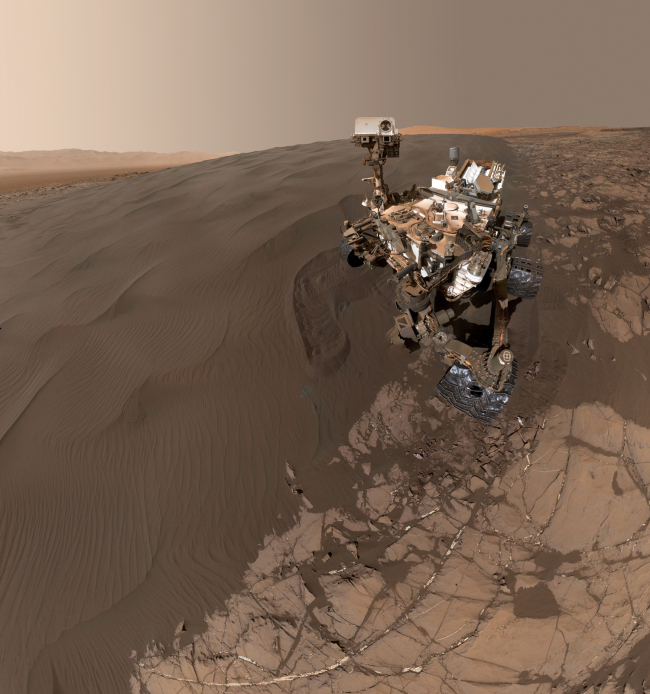 Self-portrait of NASA's Curiosity Mars rover shows the vehicle at "Namib Dune, " where the rover's activities included scuffing into the dune with a wheel and scooping samples of sand for laboratory analysis. The scene combines 57 images taken on Jan. 19, 2016.[Photo: NASA/Cover Images via IC]