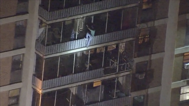 This image taken from video provided by WPVI-TV shows a man scaling down the side of a 19-story high-rise building in Philadelphia to escape a fire, Thursday, July 18, 2019.  [Photo: AP]