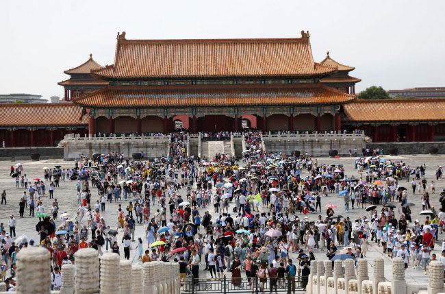 Tourists visit the Palace Museum, also known as the Forbidden City, during the peak of the summer holiday in Beijing on Sunday, July 7, 2019. [Photo: IC]