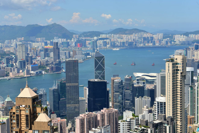 Skyscrapers and high-rise office buildings are viewed from the Victoria Peak in Hong Kong, China, 29 July 2018. [Photo: IC]<br>