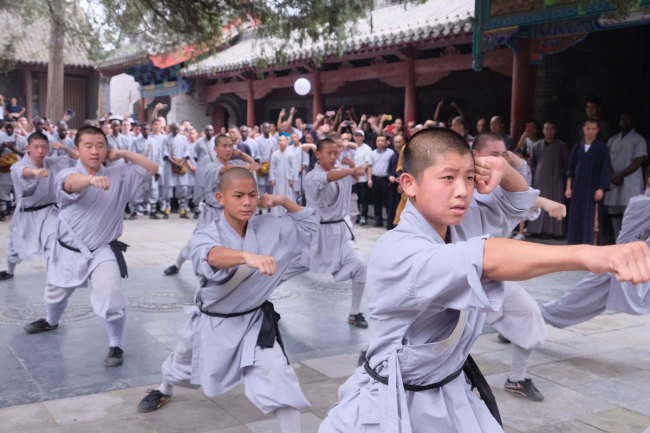 Shaolin apprentices demonstrate Chinese kung fu during the opening ceremony of the seventh Shaolin Martial Art African Apprentice Class on Monday, July 22, 2019. [Photo: IC]