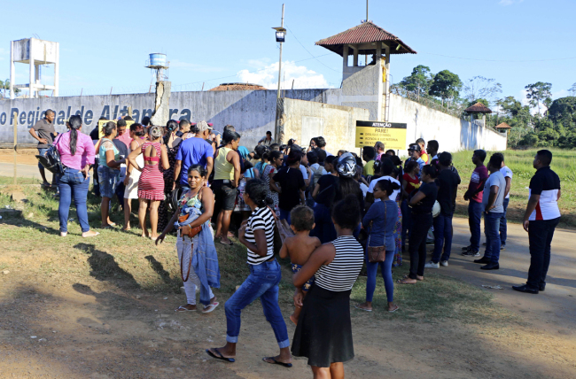 People seek information about family members who are prisoners after a riot inside the Regional Recovery Center in Altamira, Brazil, July 29, 2019. [Photo: IC]