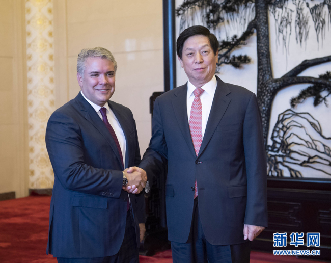 Li Zhanshu, chairman of the Standing Committee of the National People's Congress (NPC), meets with visiting Colombian President Ivan Duque Marquez at the Great Hall of the People in Beijing, capital of China, July 31, 2019. [Photo: Xinhua/Li Tao]