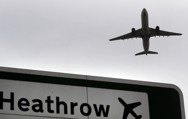 In this file photo dated Tuesday, June 5, 2018, a plane takes off over a road sign near Heathrow Airport in London. [File Photo: AP via IC/Kirty Wigglesworth]