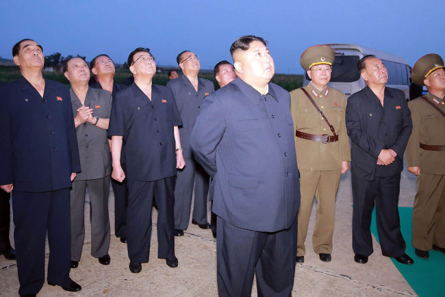 North Korean leader Kim Jong-Un (front C) observing the demonstration fire of two new-type tactical guided missiles at undisclosed western part location of the country on August 6, 2019. The picture is released from North Korea's official Korean Central News Agency (KCNA) on August 7, 2019. [Photo: KCNA VIA KNS / VCG]