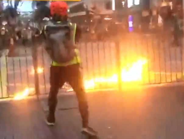 This picture shows a rioter threw petrol bombs at the police during Sunday's protests in Sham Shui Po, Hong Kong Special Administrative Region. [Photo: China Plus]