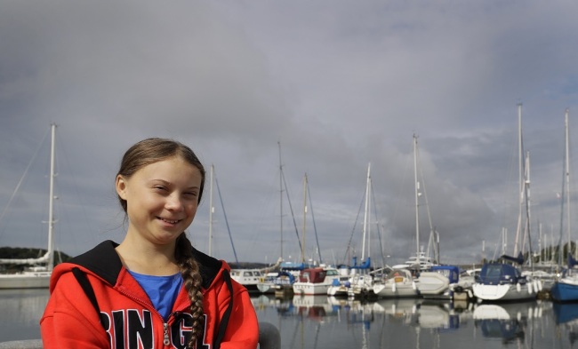 Greta Thunberg poses for a picture in the Marina where the boat Malizia is moored in Plymouth, England Tuesday, Aug. 13, 2019. [Photo: AP]