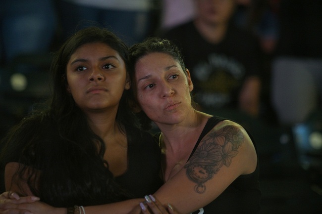 Mourners listen to "Amor Eterno" performed by mariachis during a community memorial service, Wednesday, Aug. 14, 2019, at Southwest University Park, in El Paso, Texas, for the people killed in a mass shooting on Aug. 3. [Photo: AP/Jorge Salgado]